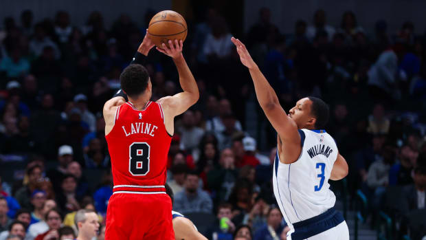 Chicago Bulls star Zach LaVine shoots over Dallas Mavericks' Grant Williams.